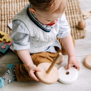 Image of an infant with baby toys